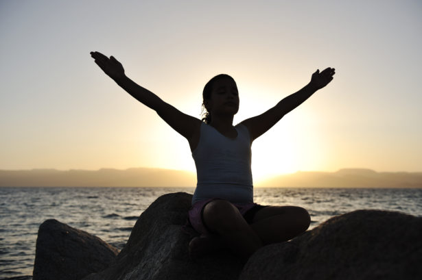 Girl on sunset excercising