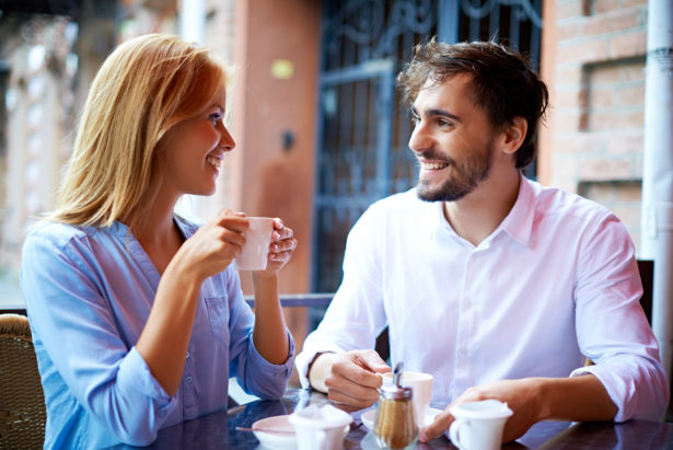 Portrait of affectionate couple having coffee in cafe