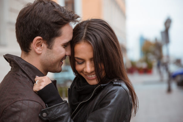 Couple hugging outdoors