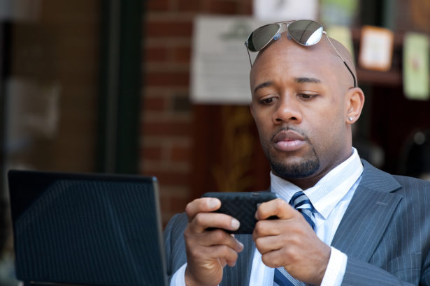 Business Man Working Wirelessly and Mobile
